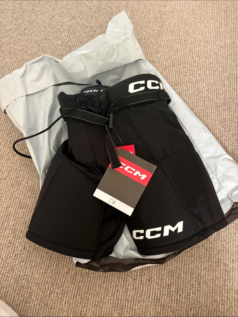 NWT CCM Black youth Hockey pants with White Logo